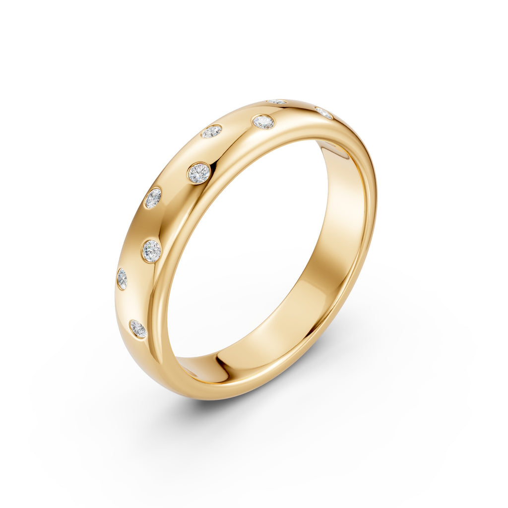 Angled view of the yellow gold Thirteen Flush Diamond Straight Band showing scattered flush-set round diamonds and its comfort-fit interior