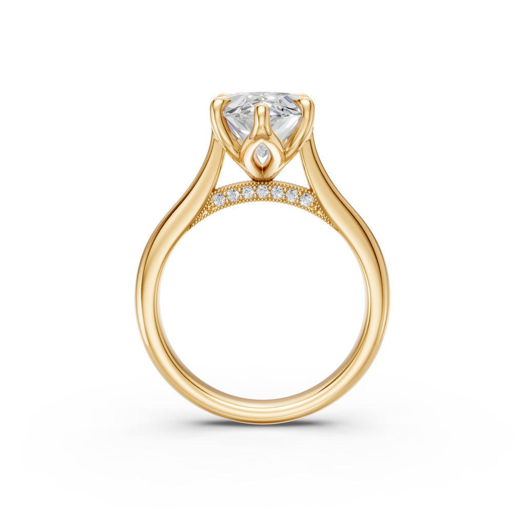 Side profile of the yellow-gold marquise ring showing cathedral shoulders and the pavé-set bridge