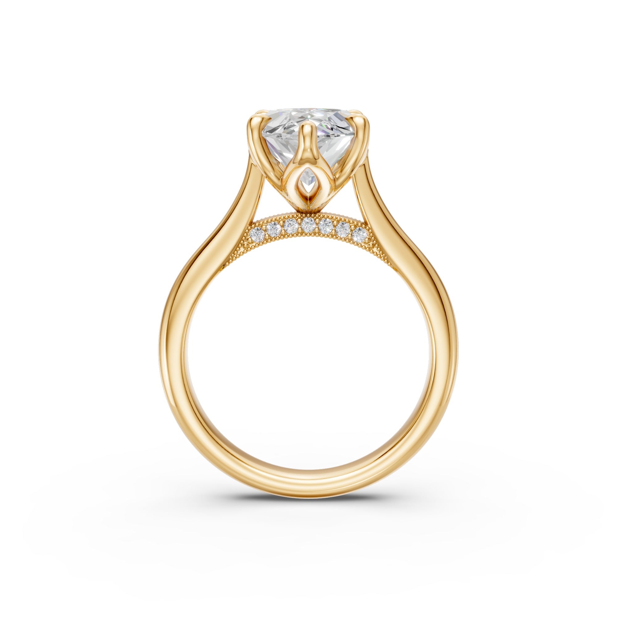 Side profile of the yellow-gold marquise ring showing cathedral shoulders and the pavé-set bridge