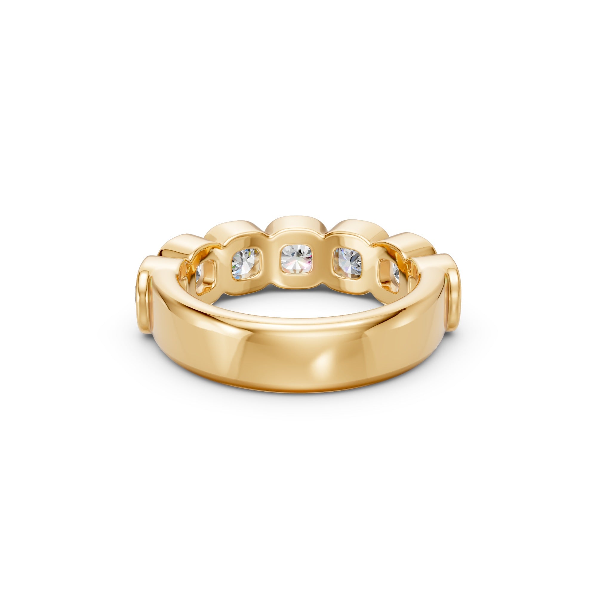 Macro detail of the yellow gold Seven-Stone Cushion Bezel Band, highlighting the matched cushion diamonds, rounded bezel edges and polished finish.