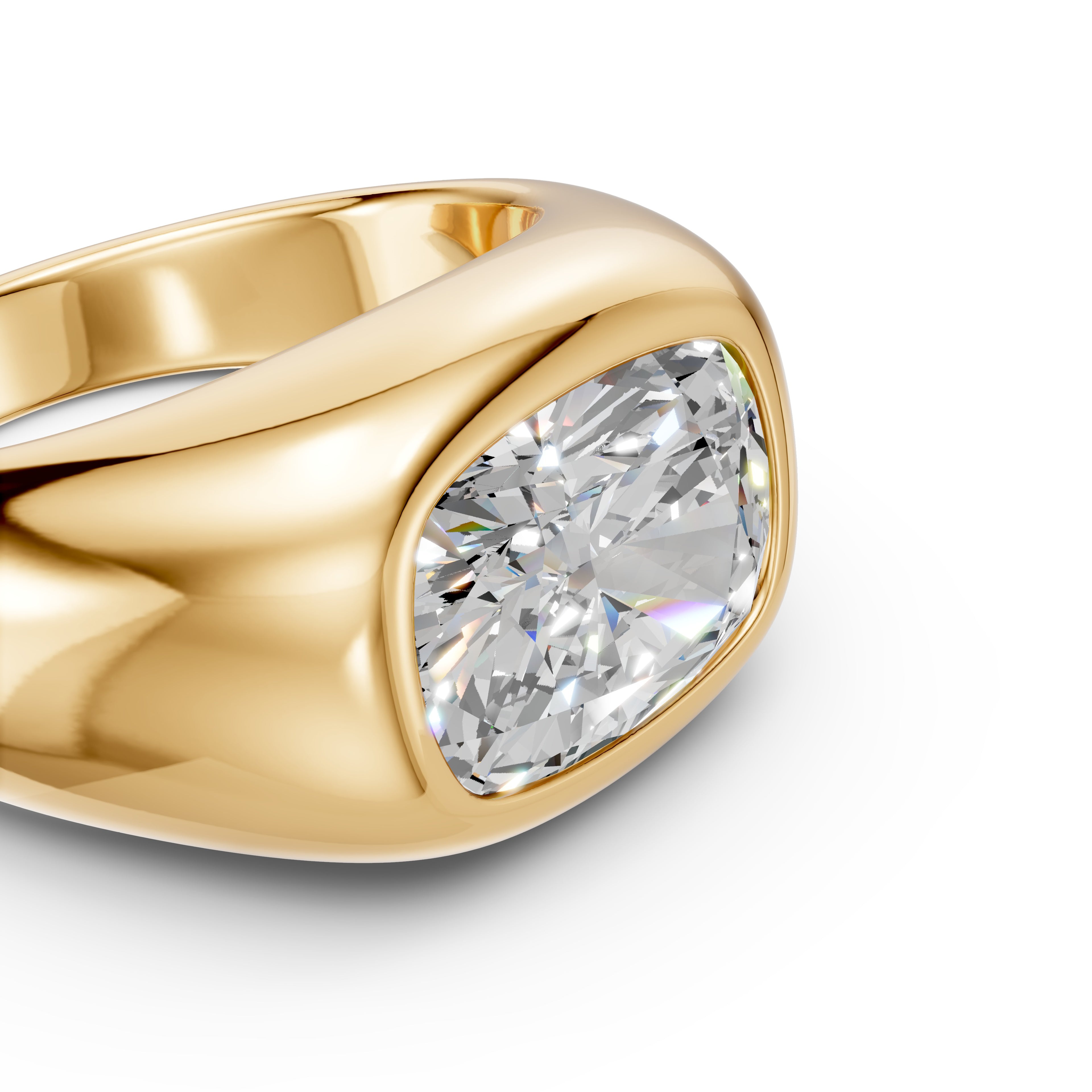 Macro detail of the yellow gold East–West Cushion Signet, highlighting the elongated cushion-cut diamond, polished bezel edge, and flowing sculpted shoulder.