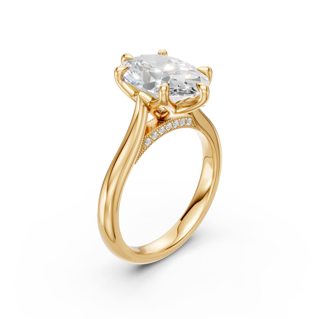 Oval lab-grown diamond ring in yellow gold, three-quarter view showing the cathedral shoulders and pavé-set bridge