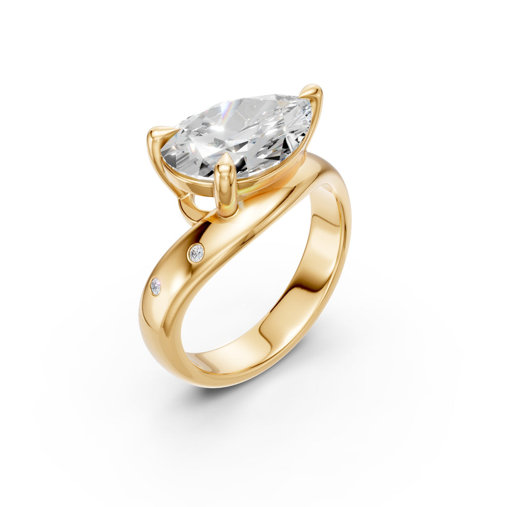 Pear Curve Ring with pear-shaped diamond and flush-set accents in yellow gold, three-quarter view