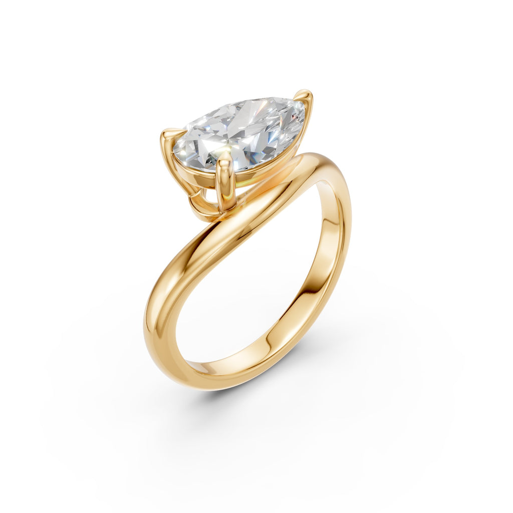 Pear Curve Solitaire Ring in yellow gold with an east–west pear-shaped diamond