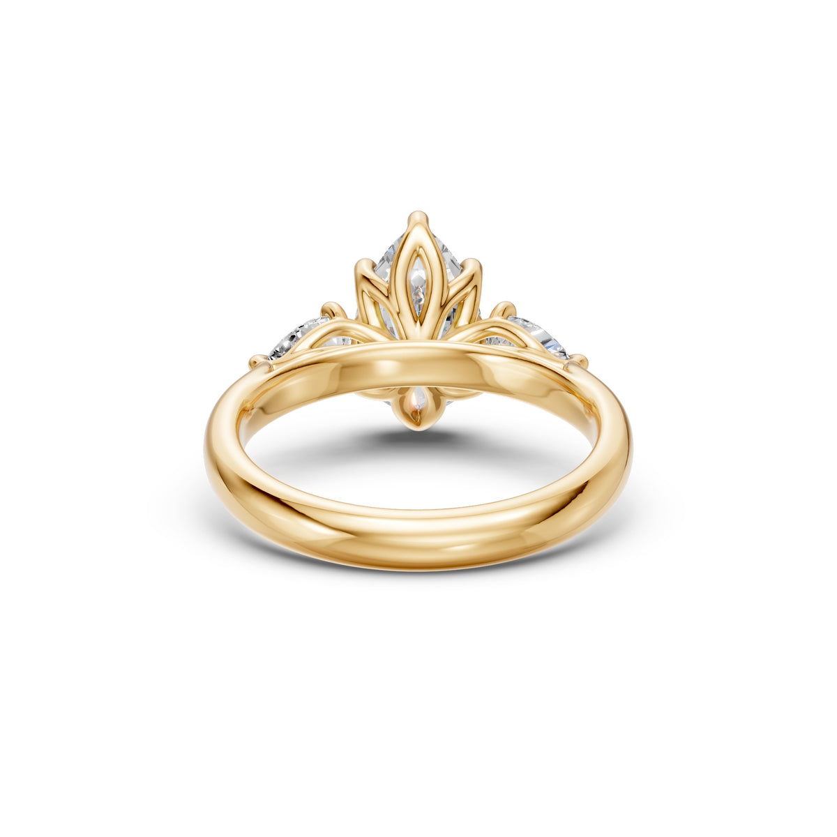 Rear view of the pear three-stone low-profile ring showing its floral basket, open gallery and polished yellow gold band