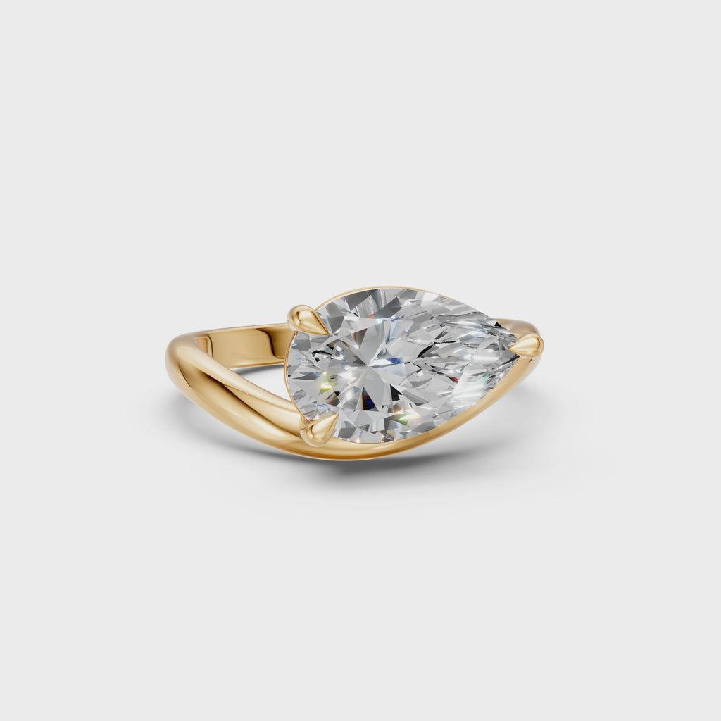 Rotating view of the Pear Curve Solitaire Ring with an east–west pear-shaped diamond