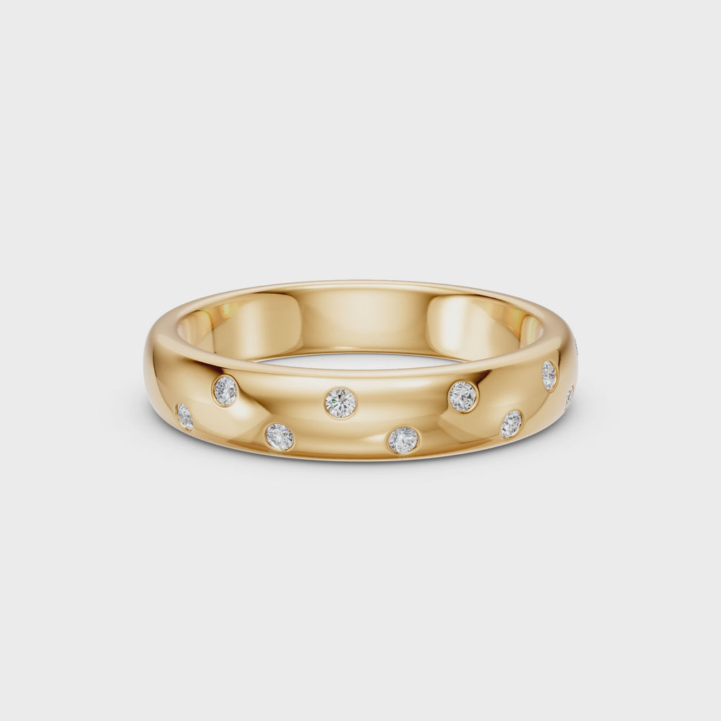 Rotating view of the yellow gold Thirteen Flush Diamond Straight Band showing its straight profile, scattered flush-set round diamonds and comfort-fit interior